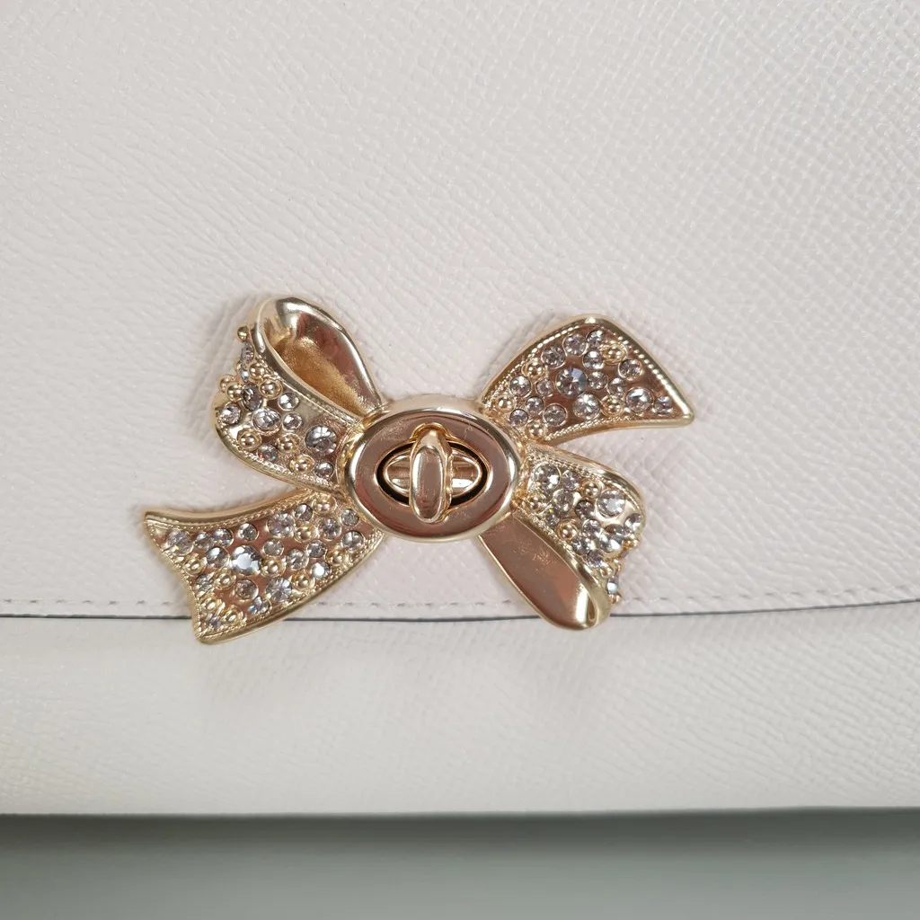 Coach Chain Crossbody Wristlet Clutch with Bow Turnlock in Chalk and Gold
